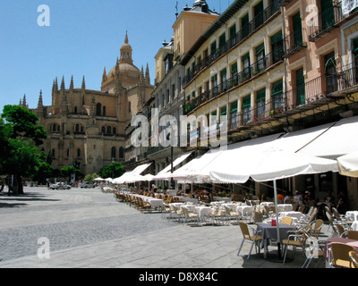 Segovia. Terraces in the main square with the cathedral Our Lady of the Assumption, XVI century, in the background. Stock Photo