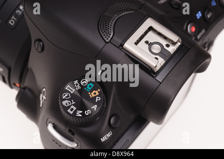 Sony Alpha 58 digital system camera - mode dial and flash shoe. Stock Photo
