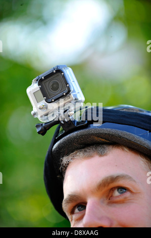 A cyclist wearing a gopro helmet camera. Stock Photo
