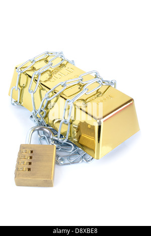 Gold bullion bar ingot chained up with padlock concept of secured money Stock Photo