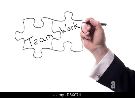 drawing pieces of a puzzle with team work text isolated on white Stock Photo