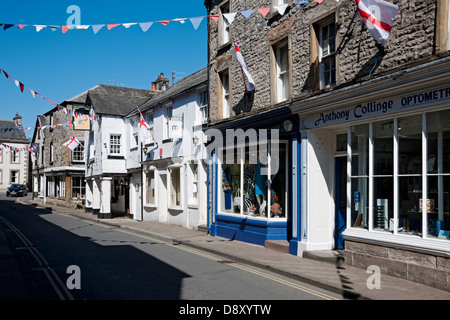 Shops stores businesses in Market Street in spring Kirkby Lonsdale Cumbria England UK United Kingdom GB Great Britain Stock Photo