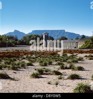 The Maximum Security Prison complex on Robben Island with Table Mountain towering in the background Stock Photo