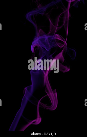 Pink and blue colored smoke pattern on black Stock Photo