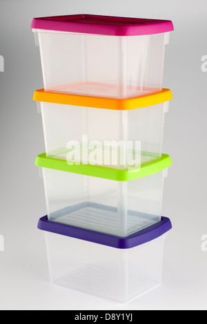 Four plastic sandwich boxes with push on different coloured tops Stock Photo