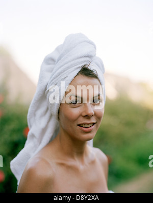 Portrait of a woman with towel on her head. Stock Photo
