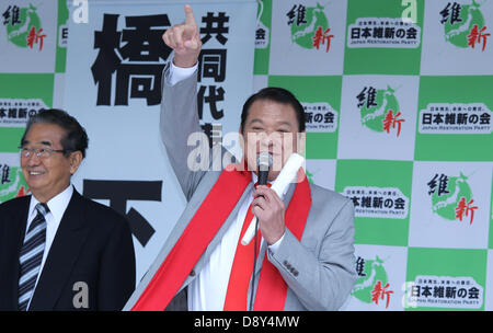 Tokyo, Japan. 6th June 2013. Former Japanese wrestler Antonio Inoki (R) and Shintaro Ishihara, co-head of the Japan Restoration Party gesture during the House of Councillors election campaign at Shibuya crossing on June 6, 2013 in Tokyo, Japan. (Credit Image: Credit:  Koichi Kamoshida/Jana Press/ZUMAPRESS.com/Alamy Live News) Stock Photo