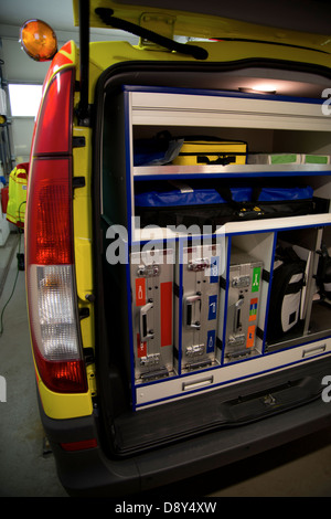 Paramedic emergency vehicle from the back with open door and equipment inside. EMS Stock Photo