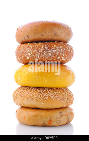 A stack of five different bagels on a white background with reflection. Stock Photo
