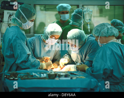 Team doctors performing heart operation Stock Photo