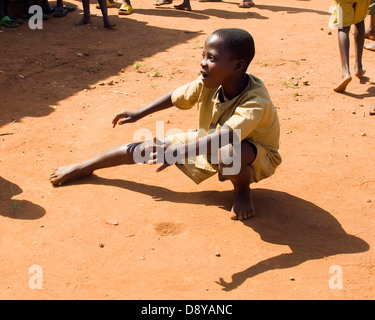 Ruhagurika Primary School boys playing marbles during their playtime outside Ruhagurika Catch-Up Class Catch up classes were Stock Photo