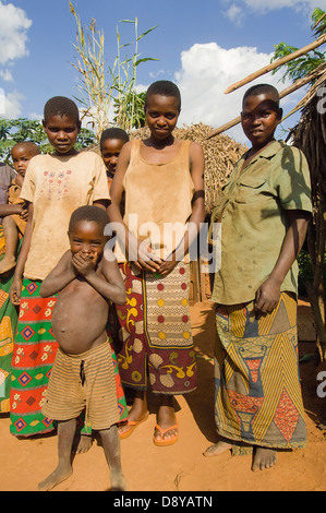 A family beside the road living in poverty child with obvious worms African Burundian Children Eastern Africa Female Women Girl Stock Photo