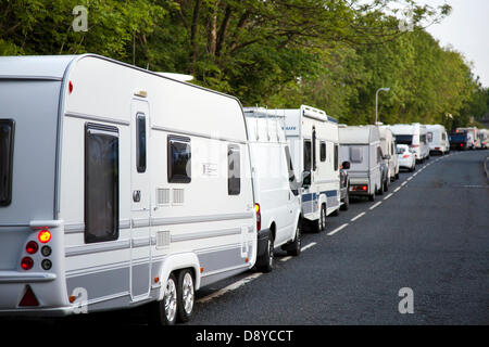 Bumper to bumper traffic at Appleby, Cumbria, UK. 6th June, 2013.  A long line of parked caravans or trailer homes in lay by.  Early morning and long queues on the road side caused by horses going to the Appleby Horse Fair in Cumbria.  The Fair is an annual gathering of Gypsies and Travellers which takes place on the first week in June, and has taken place since the reign of James II, who granted a Royal charter in 1685 allowing a horse fair 'near to the River Eden.' Stock Photo