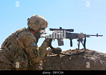 US Army soldier provides security during Operation Shamshir VI May 8, 2013in Khoti Kheyl, Zormat district, Afghanistan. Stock Photo