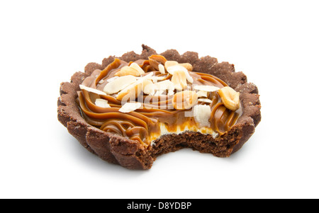 bitten chocolate tart with caramel isolated on white background Stock Photo
