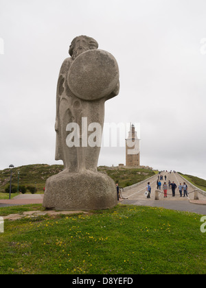 Statue of celtic king Breogan in front of the Hercules Tower in La Coruna, Spain Stock Photo