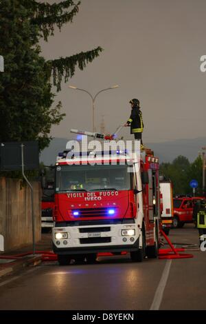 firefighters in action with the fire truck to extinguish the fire in a chemical factory flammable Stock Photo