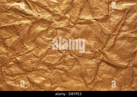 Crumpled gold paper Stock Photo