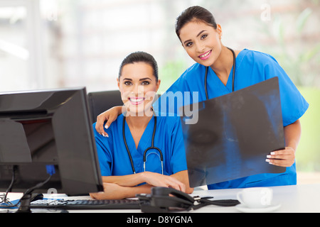 portrait of two young medical workers with x-ray Stock Photo