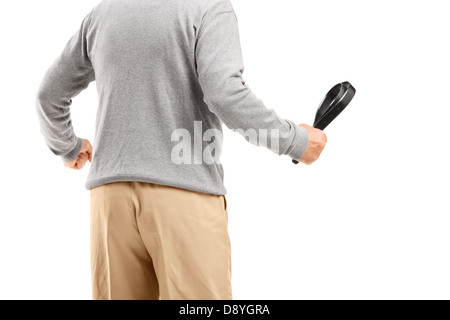 Angry man holding a belt, ready to beat someone, isolated on white background Stock Photo