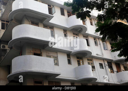 Dec 01, 2012 - Mumbai, Maharashtra, India - Detail Of Art Deco Building at Mumbai. Art Deco buildings in Mumbai, India have found a new legion of fans after a stretch of structures built in the 1920s, 30s and 40s became last year one of two Indian bids to be declared as a Unesco World Heritage Site. Mumbai has one of the largest concentrations of original and surviving Art Deco edifices in the world, second only to Miami. Deco buildings cropped up at a time of exuberant optimism and opulence in Mumbai. The Art Deco style in Mumbai was characterized by elegant features such as fountains, styliz Stock Photo