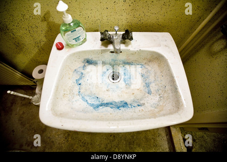 Dirty bathroom sink Stock Photo