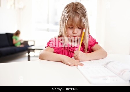 Girl doing homework Stock Photo
