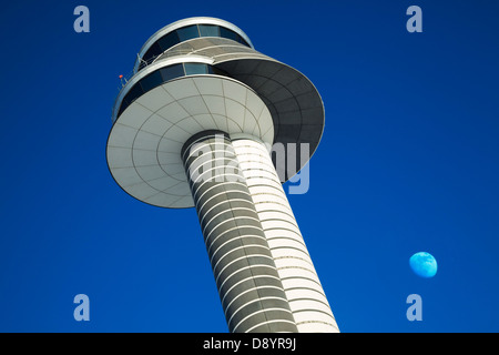 Low angle view of air traffic control tower against blue sky Stock Photo
