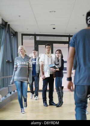 Students standing in corridor Stock Photo