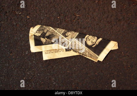 A newspaper on the ground, USA. Stock Photo