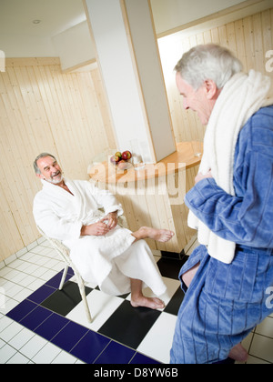 Two men in bathrobes. Stock Photo