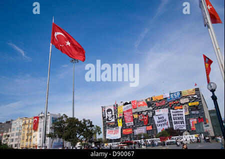 Istanbul, Turkey. 6th June 2013.  Ataturk Culture Center was covered with banners by the protesters. On 31st May a previously peaceful protest against the demolition of Gezi Park and the construction of another shopping mall in its place at Taksim Square turned violent when police attacked protesters with teargas and water canons early in the morning. A two days fight with extreme and unjust police brutality followed. Finally police withdrew and since then Taksim Square and Gezi Park are occupied by a great variety of Turkish citizen. Many put up tents and stay overnight. Photo by CLAUDIA WIEN Stock Photo