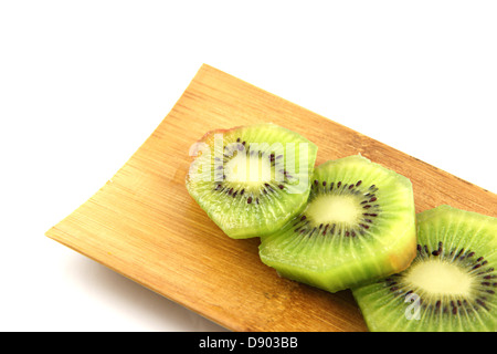 The Kiwifruit slices into pieces on the Bamboo dish. Stock Photo