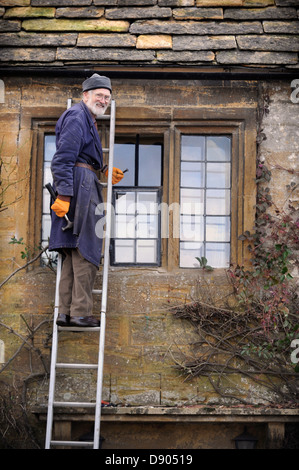 The village of Montacute in Somerset where residents can expect the country's highest life expectancy - an elderly man repairing Stock Photo