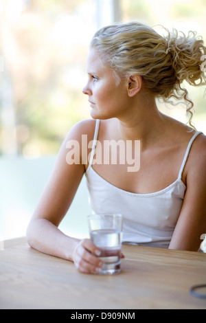 A young woman drinking water. Stock Photo