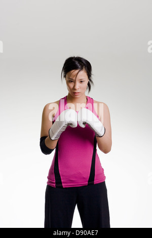 A woman with boxing gloves. Stock Photo