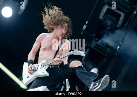 Nuremberg, Germany. 7th June 2013. Front man of Australian band Airbourne, Joel O'Keeffe (C), performs at the music festival 'Rock im Park' in Nuremberg, Germany, 07 June 2013. Over 70,000 rock musicians are expected to the festival which continues until 09 June. Photo: DANIEL KARMANN/dpa/Alamy Live News Stock Photo