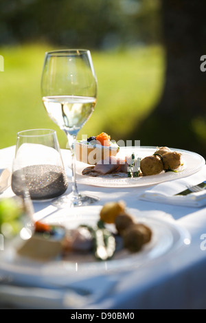 Midsummer party, plates on a table, Fejan, Stockholm archipelago, Sweden.