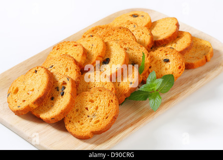 Small round toasts with black olives Stock Photo