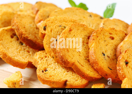 Small round toasts with black olives Stock Photo