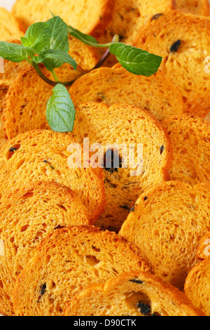 Small round toasts with black olives Stock Photo