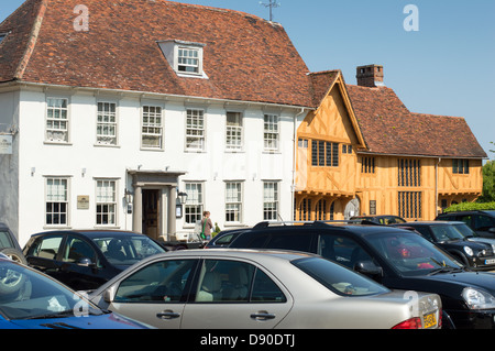 Cars parked in the Market Square, Levanham, in front of historic buildings. Stock Photo