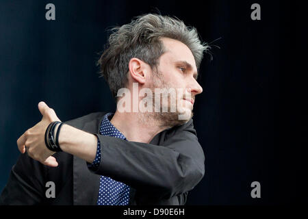 Nuremberg, Germany. 7th June 2013. Front man of German band Tocotronic, Dirk von Lowtzow, performs at the music festival 'Rock im Park' in Nuremberg, Germany, 07 June 2013. Over 70,000 rock musicians are expected to the festival which continues until 09 June. Photo: DANIEL KARMANN/dpa/Alamy Live News Stock Photo