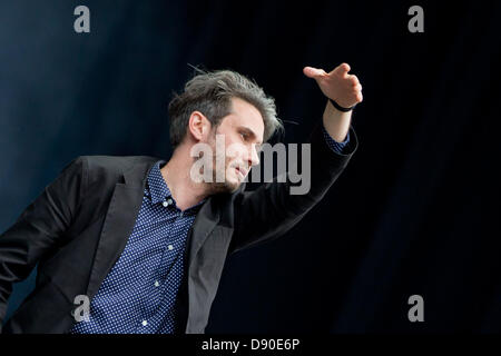 Nuremberg, Germany. 7th June 2013. Front man of German band Tocotronic, Dirk von Lowtzow, performs at the music festival 'Rock im Park' in Nuremberg, Germany, 07 June 2013. Over 70,000 rock musicians are expected to the festival which continues until 09 June. Photo: DANIEL KARMANN/dpa/Alamy Live News Stock Photo