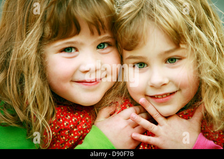 Portrait of two girls smiling Stock Photo - Alamy