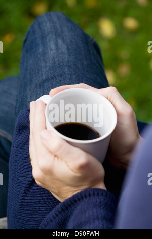 Woman holding coffee cup Stock Photo