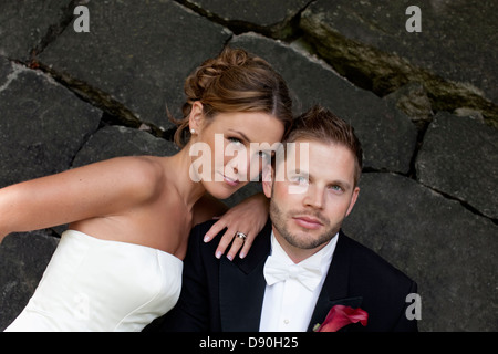 Bride and groom looking at camera Stock Photo