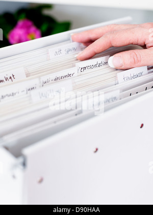 Womans hand on diary, close-up Stock Photo