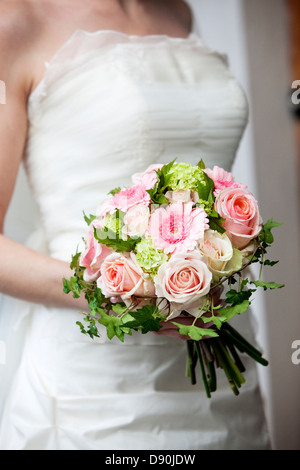 Close-up view of bride holding bouquet Stock Photo