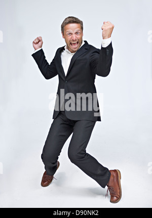 Businessman dancing and screaming Stock Photo